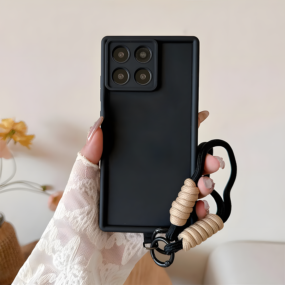 Black phone case with a beige rope handle held by a hand against a neutral background